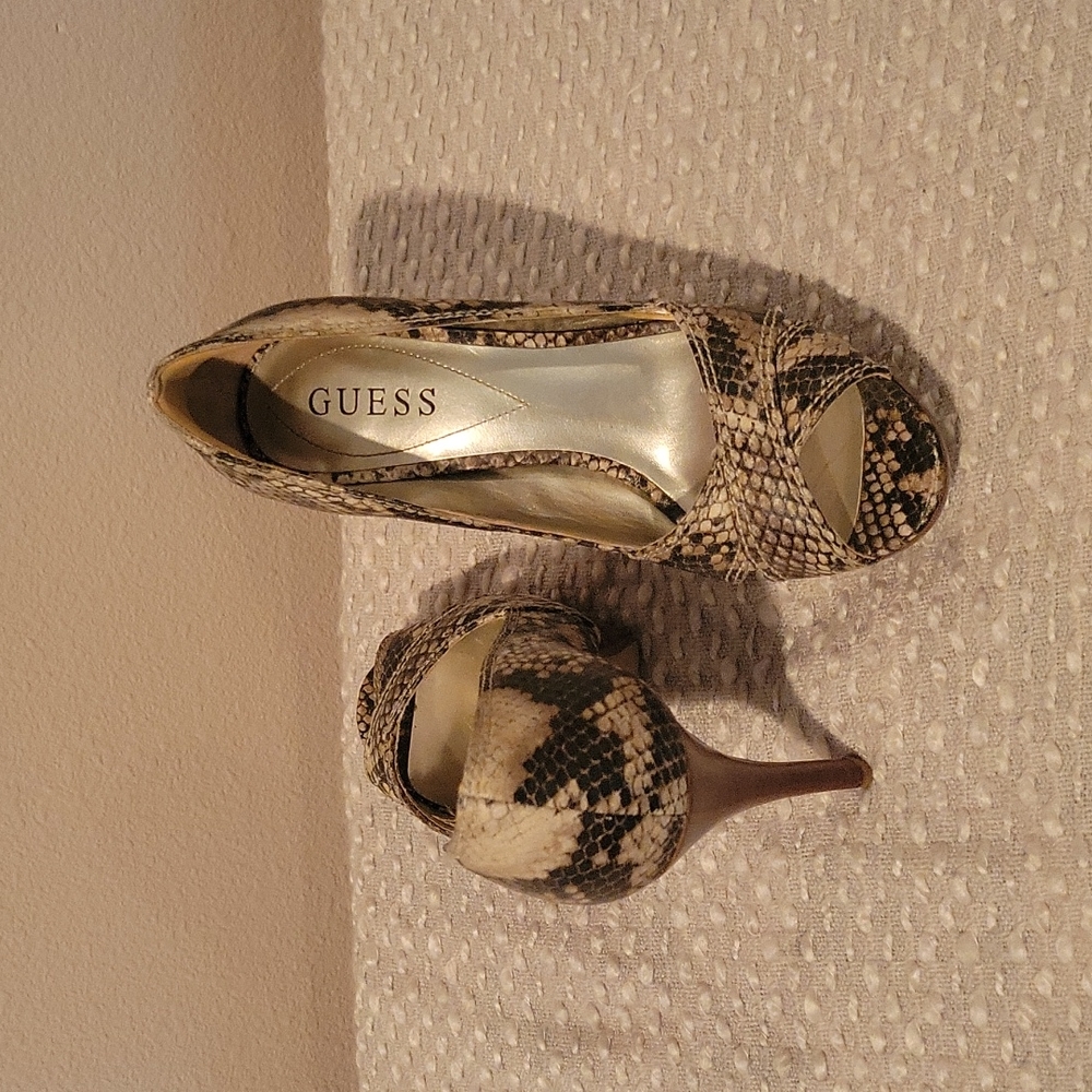 Gently used Guess snake print heels.